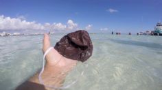 Inundan playas de Cancún con cubrebocas