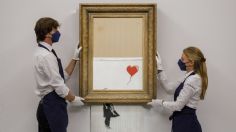 La obra de Banksy que se autodestruyó tras ser subastada, fue comprada por 25.4 millones de dólares