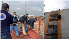 ¡Ahí va el agua! Retiran tinaco ‘equilibrista’ del balcón de un departamento en Iztacalco