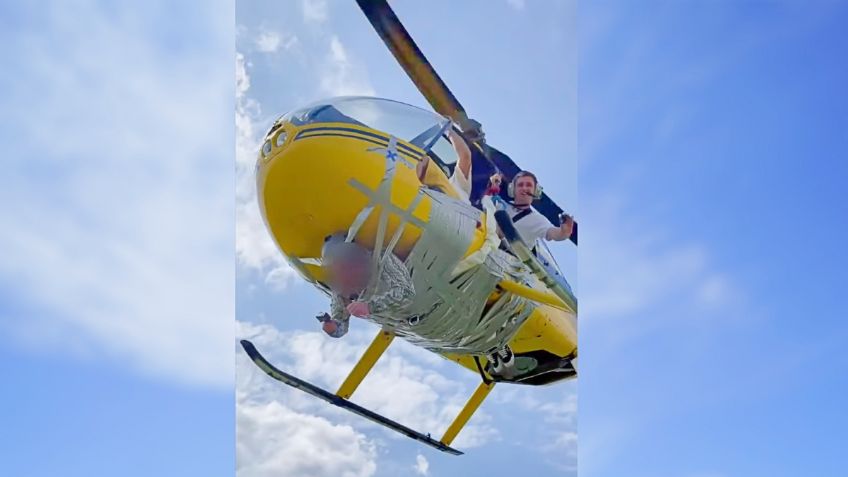 ¡Extremo! Youtuber encinta a hombre a un helicóptero y sobrevuelan por Moscú: VIDEO