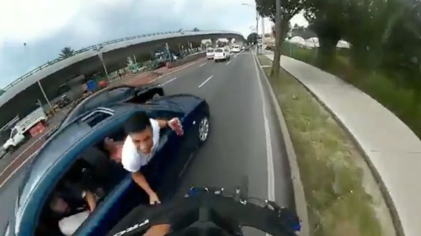 Hombre intenta presuntamente tirar a ciclista desde auto en movimiento: VIDEO VIRAL