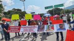 Bloquean la Autopista del Sol para exigir la presentación con vida de tres desaparecidos