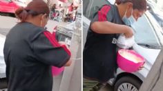 Mujer es captada usando poste de luz para conectar su batidora | VIDEO