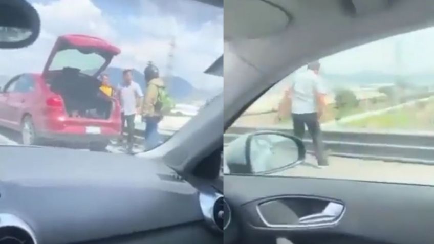 Hombre avienta de un puente vehicular a repartidor durante pelea | VIDEO FUERTE