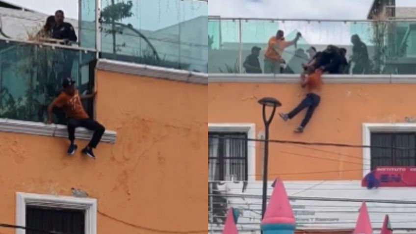 Con castillo inflable salvan a hombre que intentaba lanzarse desde tercer piso de un edificio en Puebla | VIDEO