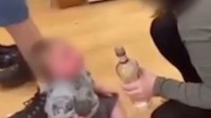 FOTOS: Arrestan a padres que dieron de beber vodka a su bebé