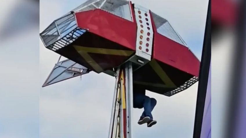 VIDEO: Hombre queda colgando a 9 metros de altura de juego mecánico por rescatar a una niña