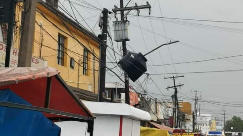 Un tinaco entre los cables, un muerto y postes caídos: el saldo de una tromba que azotó Tamaulipas