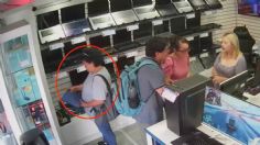 VIDEO: exhiben a mujer que fingió ser clienta de una tienda y robó una computadora