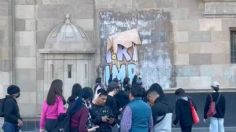 Comunidad LGBTTIQ+ realiza pintas en Palacio Nacional por la muerte de 5 mujeres trans