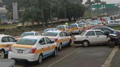 Cientos de taxistas bloquean carreteras en la zona centro de Veracruz: exigen alto a los "moches"