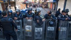 Comerciantes bloquean Circunvalación tras desalojo de local en la Merced