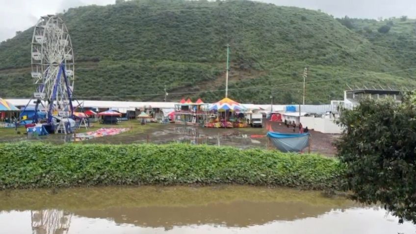 San Pedro Atocpan sigue bajo el agua tras inundarse la Feria del Mole | VIDEOS