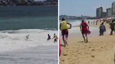 VIDEO: graban el momento exacto en que unos salvavidas de Acapulco rescatan a dos personas arrastradas por el mar de fondo