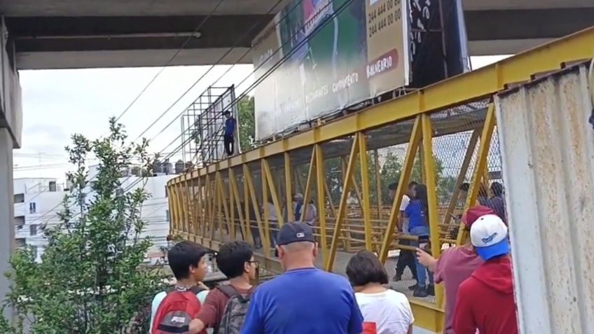 VIDEO: el momento heroico en el que un ciudadano salva a un joven de arrojarse de un puente en la México-Puebla