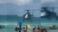 Policía tira su rifle al mar desde un helicóptero y bañistas se lo devuelven | IMÁGENES IMPACTANTES