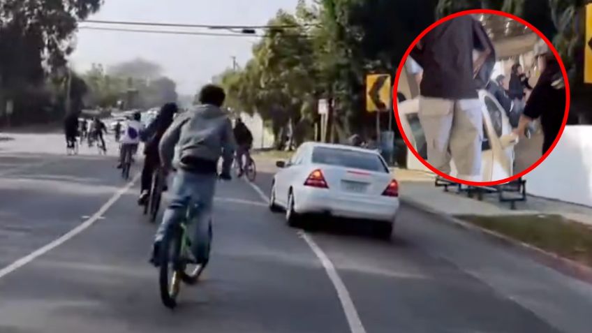 Automovilista intenta arrollar a ciclistas, quienes hacen justicia por su propia mano | VIDEO